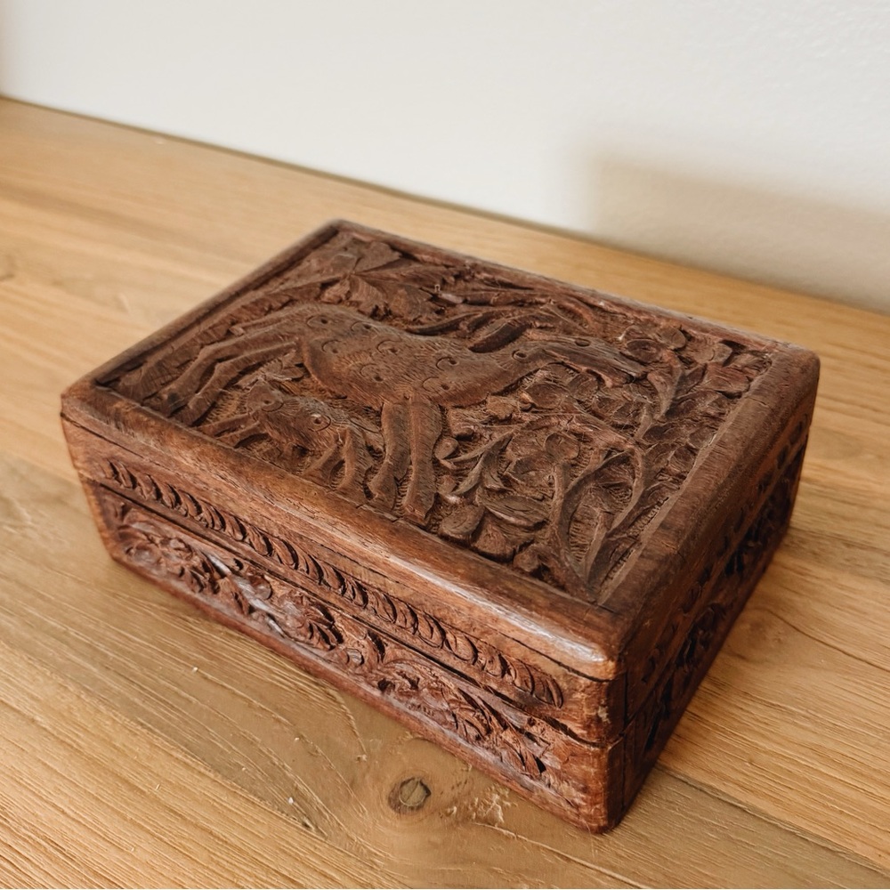 Vintage brown carved wooden trinket box with a unique design